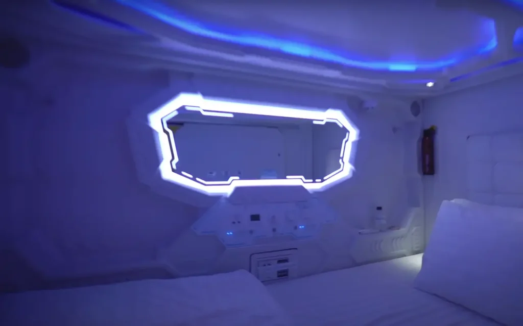Compact and modern capsule hotel room at Bangkok Airport.