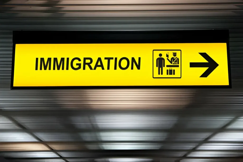 Immigration sign at Bangkok Airport for travelers.